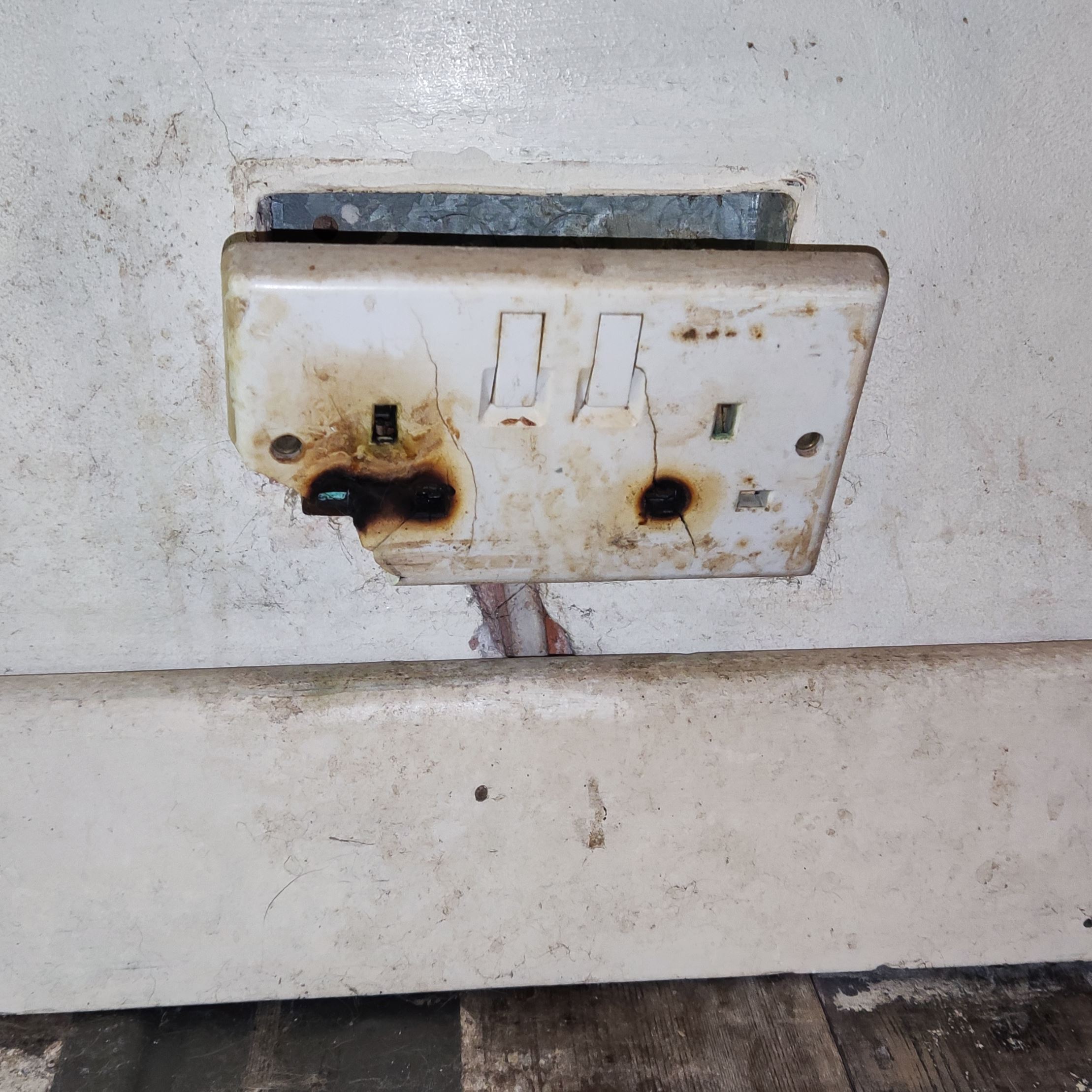 electric socket overloaded and cracked