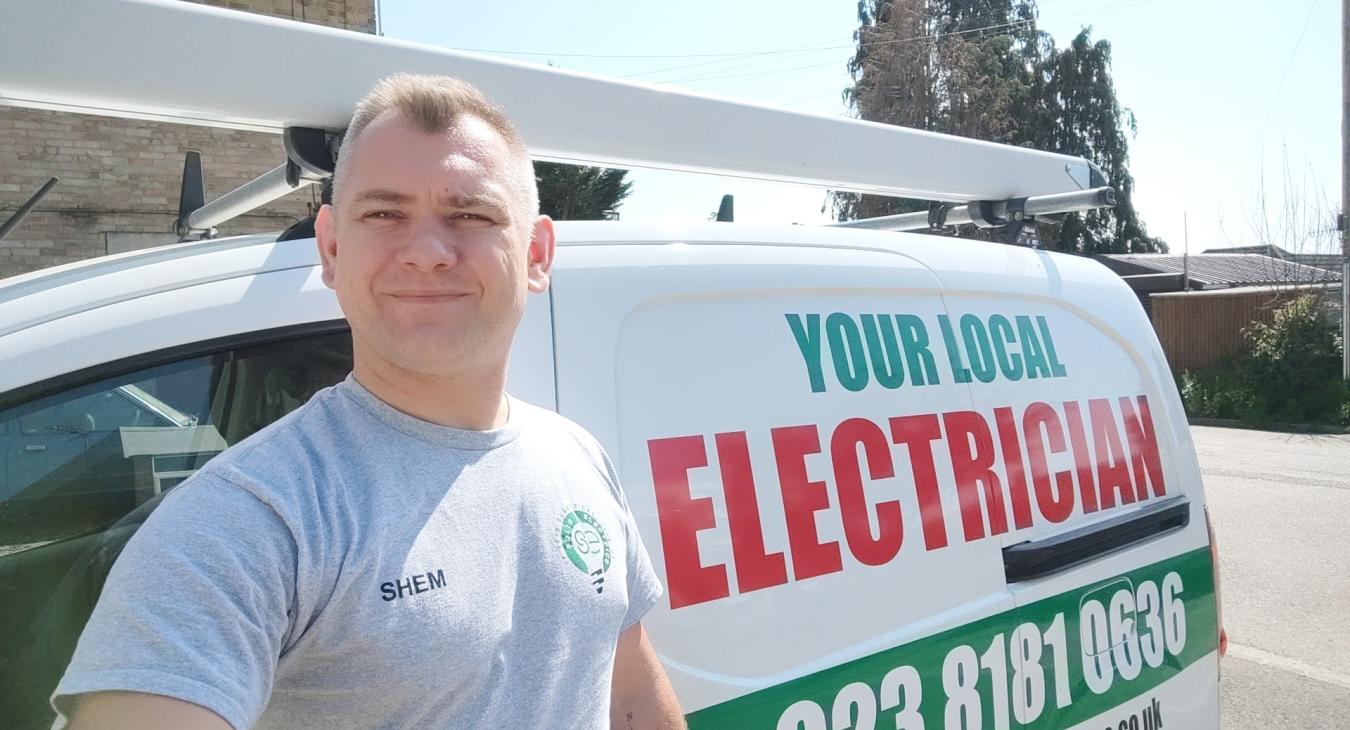 Local Reliable Electrician serving Southampton in front of his Van getting ready to work