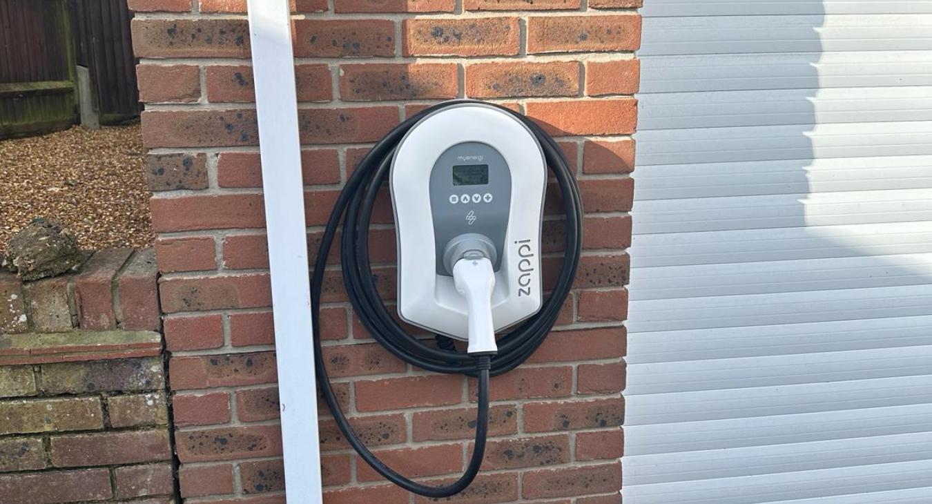 zappi ev charging point installed on the front of the garage 25 m away from consumer unit